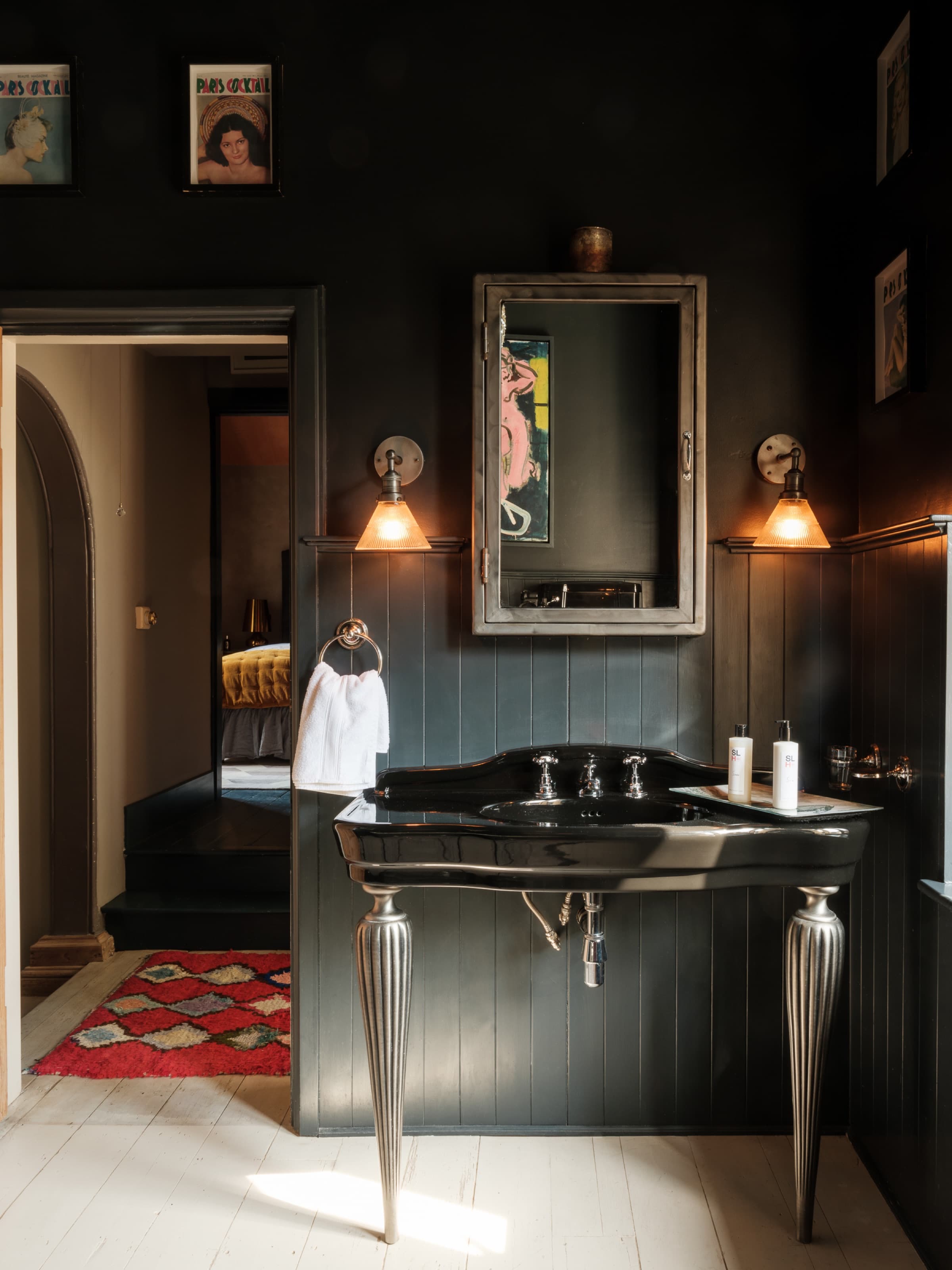 Dark panelled bathroom, silver fittings