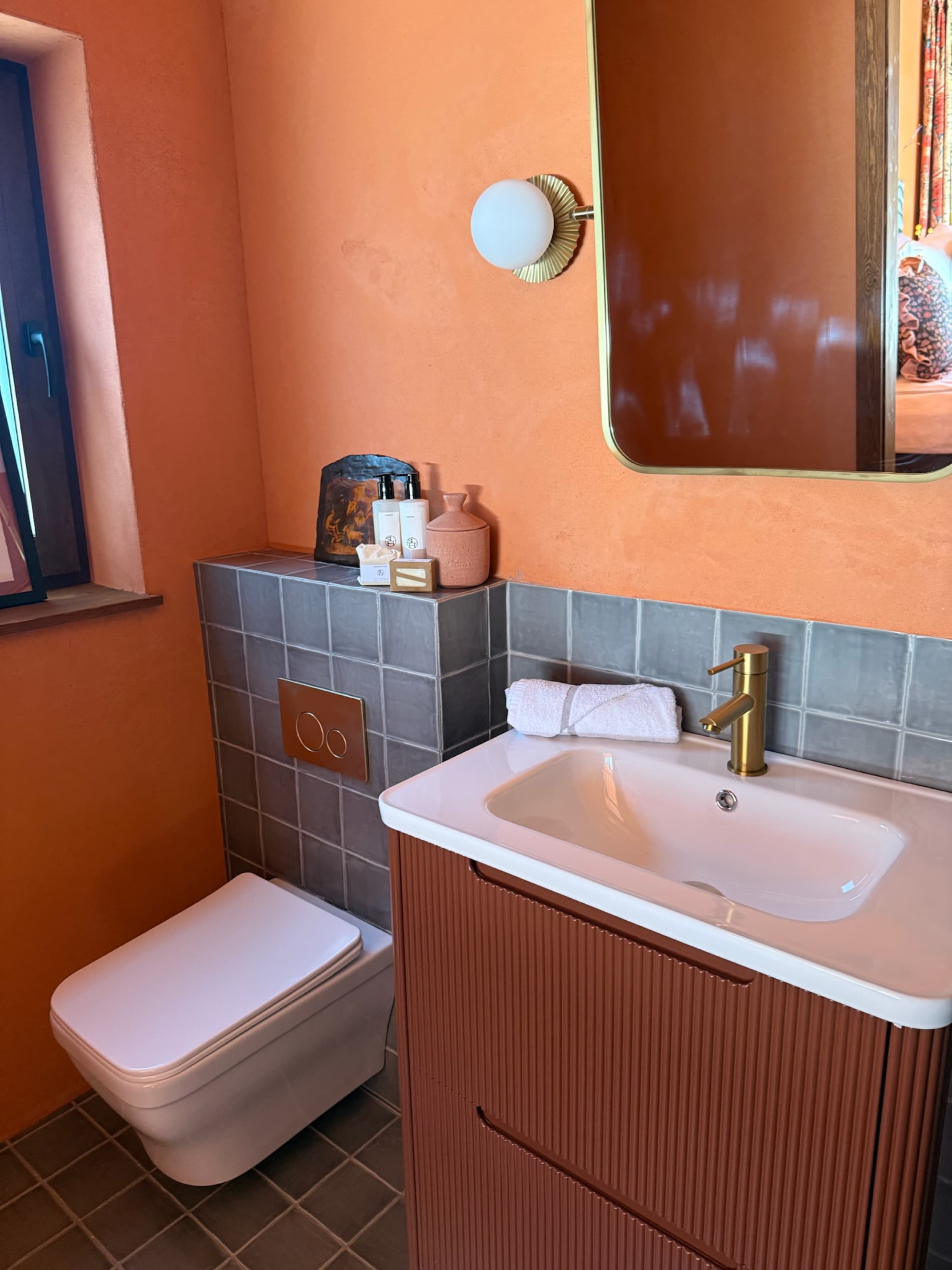 Bedroom Two ensuite, terracotta walls, brass fittings