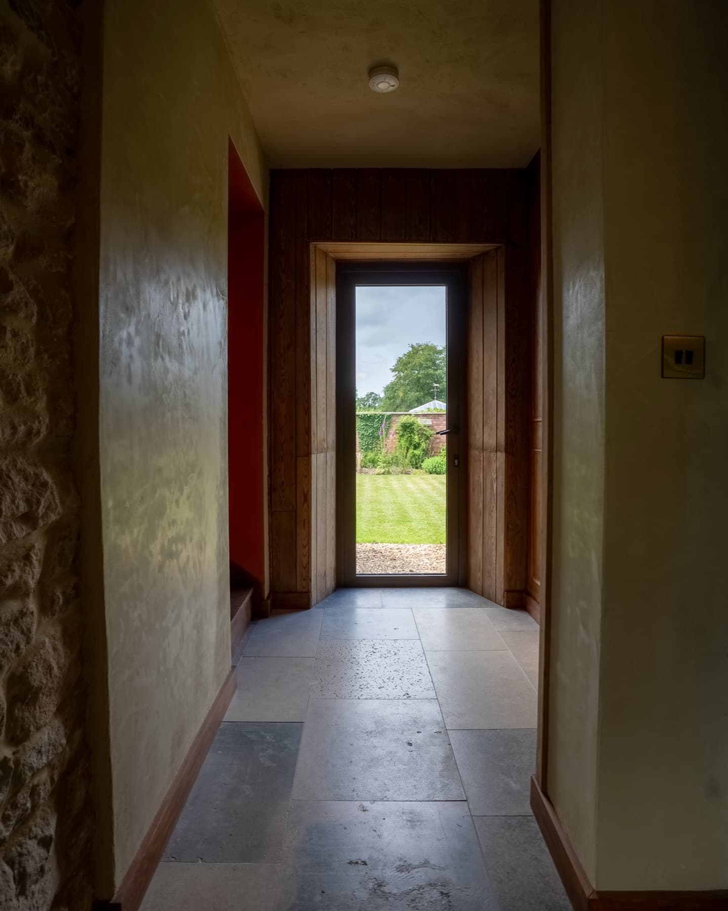 Oak doorway opening to the garden