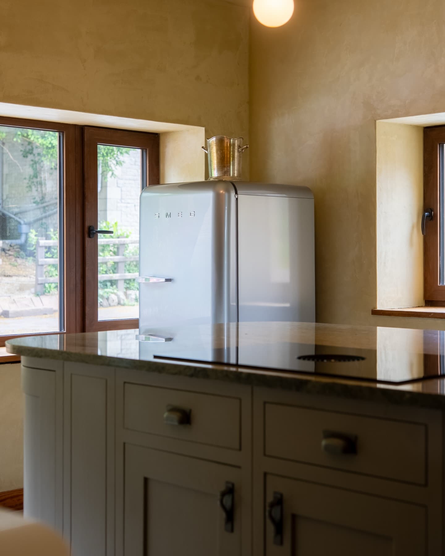 Smeg fridge and marble island corner