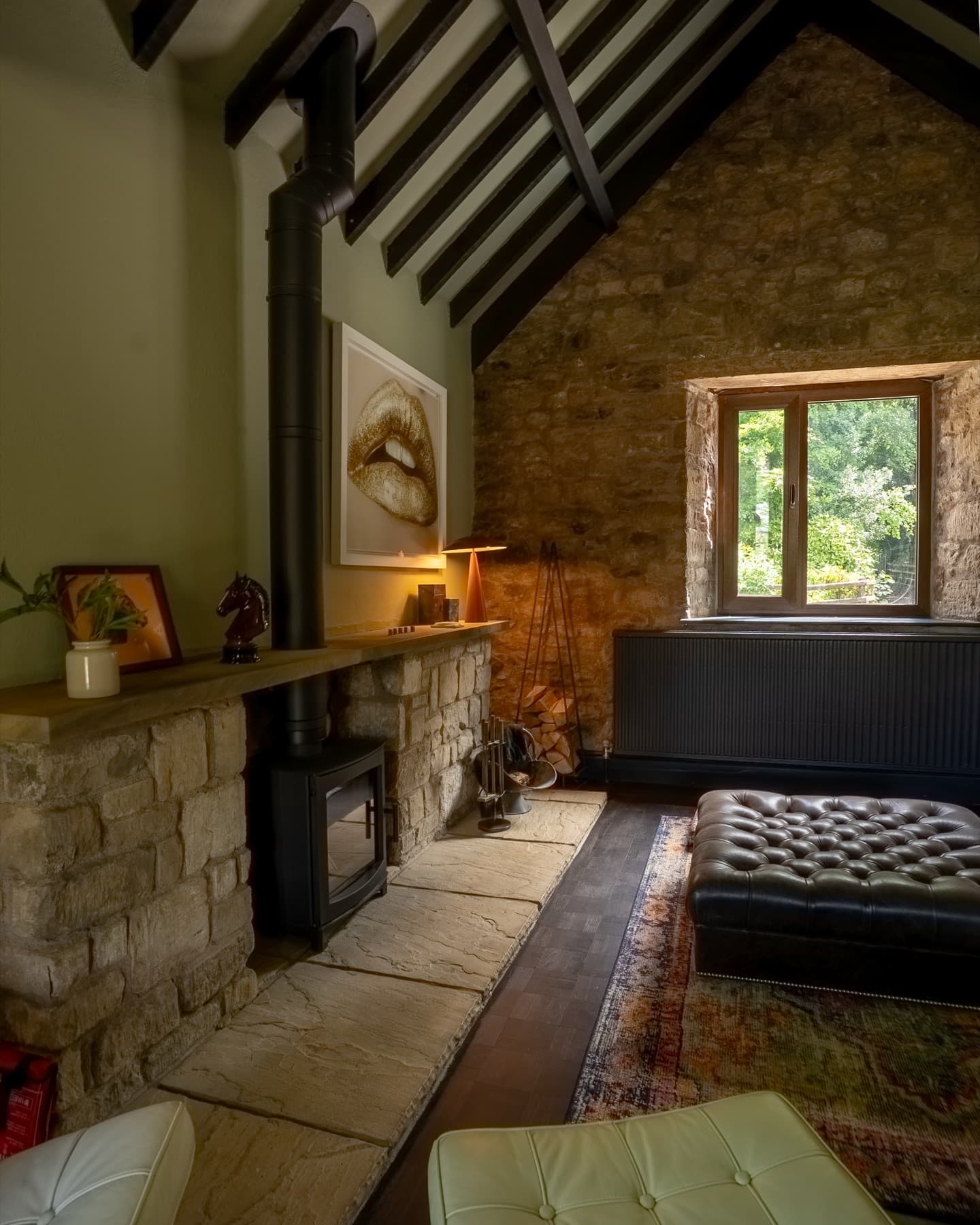 Living room fireplace, log burner and stone chimney breast
